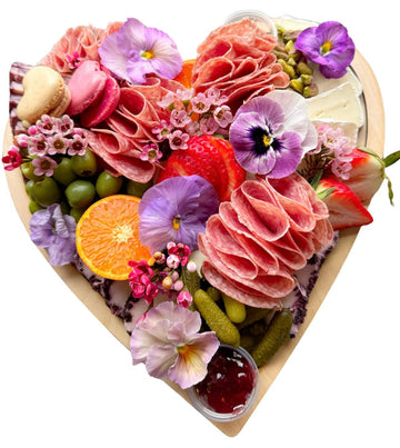 heart shaped cheese and charcuterie board curated spread